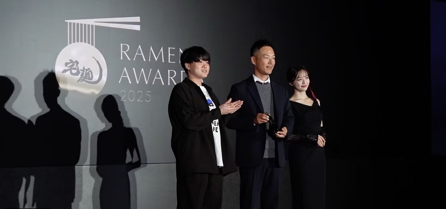 Japanese Chef & CEO Takuma Ishikawa (middle) receiving the Mazesoba Grand Award | Vermillion Pinstripes
