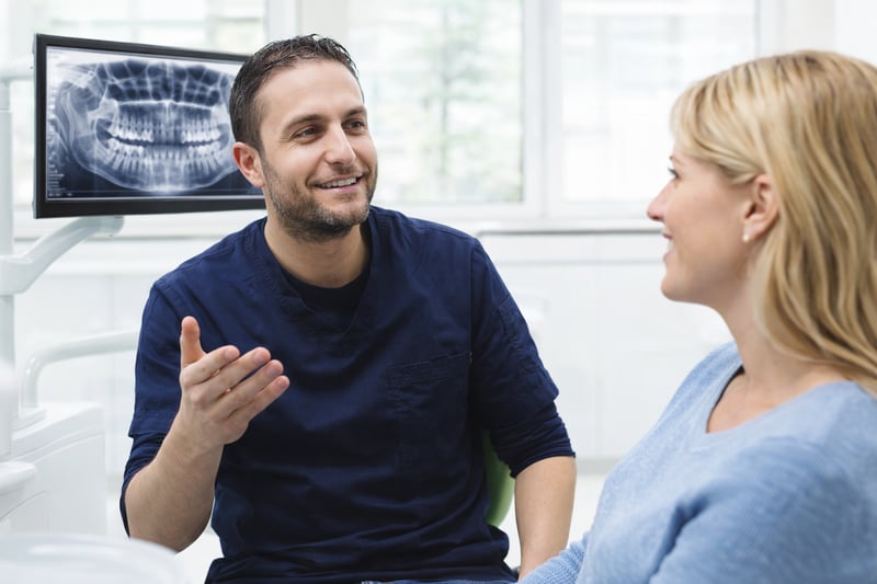 Dr Molham Mid North Coast Dental consulting with patient