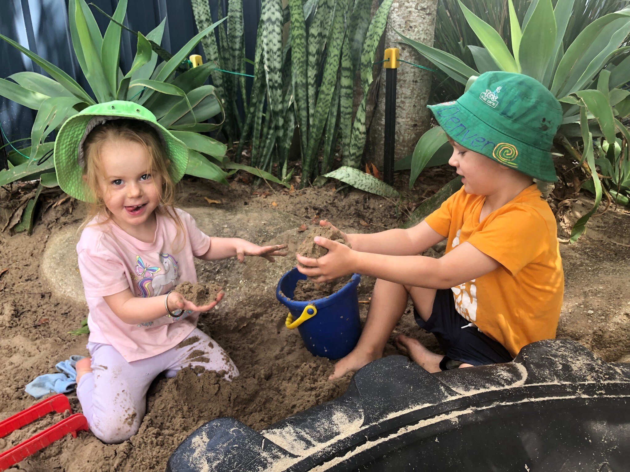 TGs Child Care Hastings St Children having fun with mud play in gardens